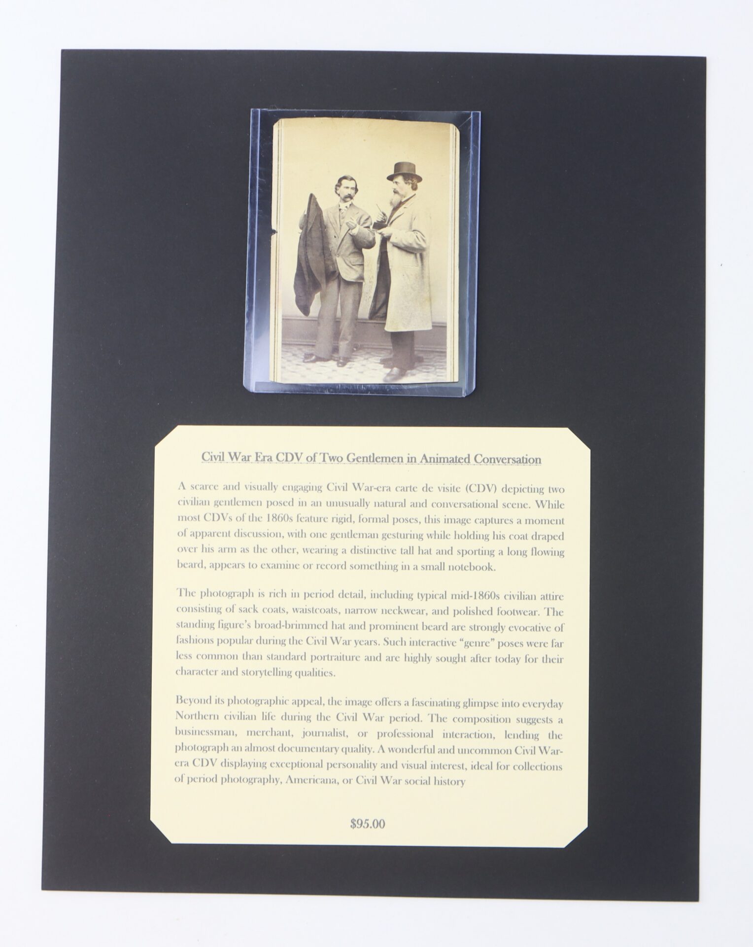 A mounted display featuring an old photograph of two men in conversation, with a descriptive label about Civil War era CDVs and a $95 price tag.