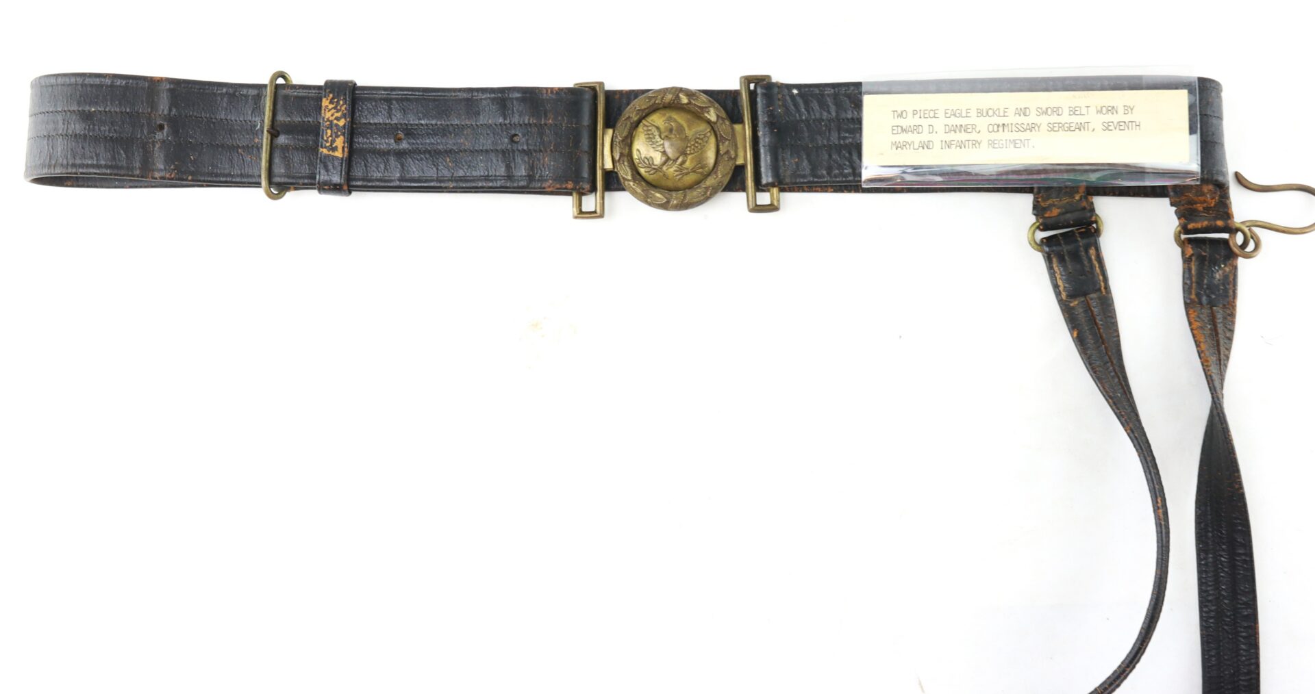 A vintage black leather military belt with a brass eagle buckle and a label identifying it as belonging to a sergeant in the Seventh Maryland Infantry Regiment.