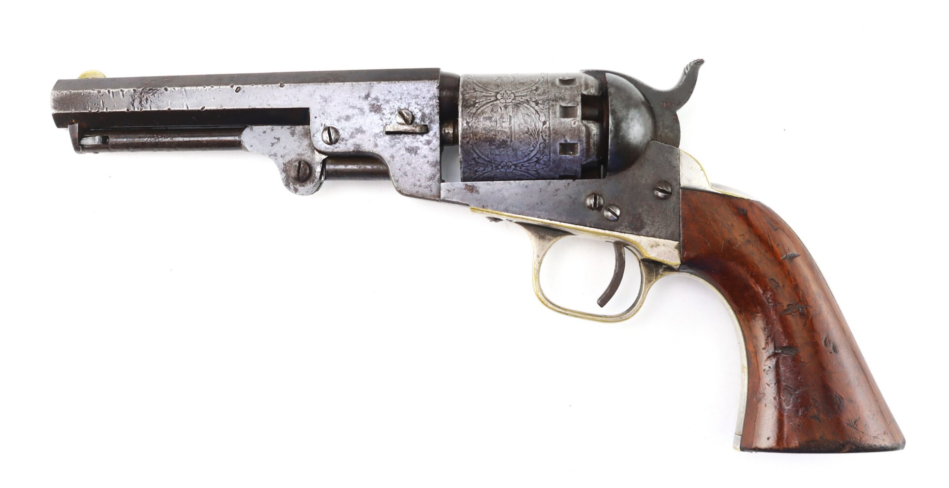 Antique revolver with a wooden grip, metal cylinder, and barrel, displayed against a white background.