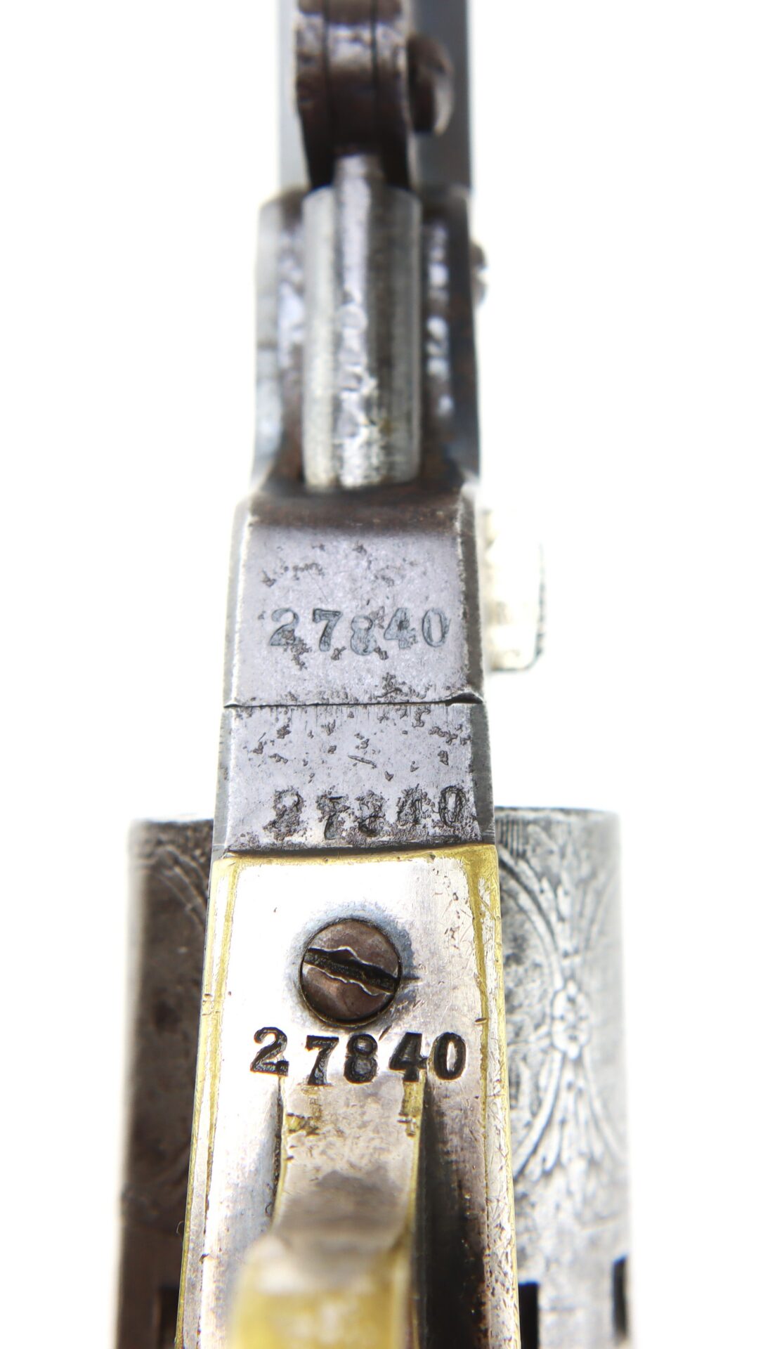 Close-up view of a firearm showing three instances of the serial number 27840 engraved on different metal parts.