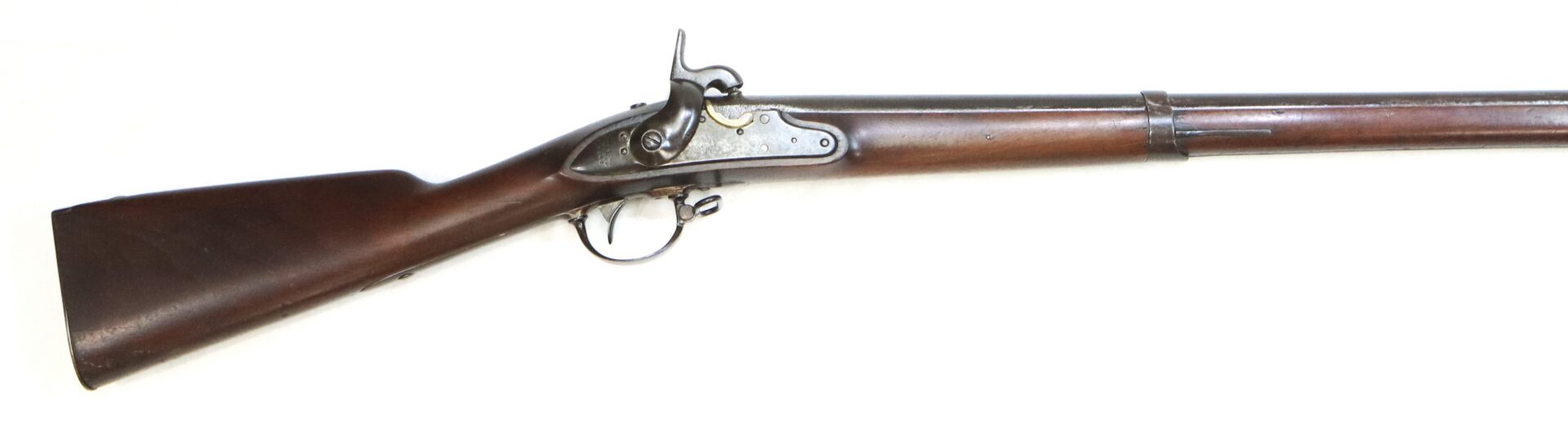 A vintage flintlock musket with a wooden stock and metal barrel, shown in profile on a white background.
