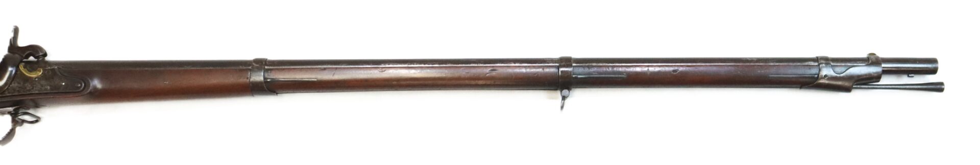 A vintage, long-barreled musket with a wooden stock and metal fittings, shown in a side view against a white background.