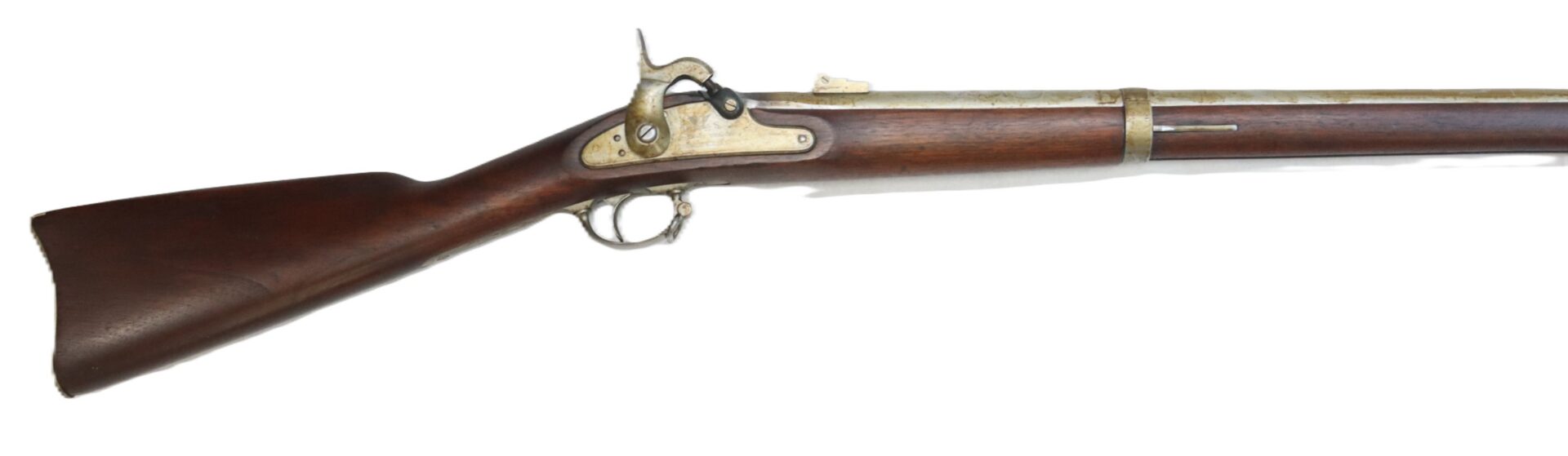 Side view of an antique single-shot percussion cap rifle with a wooden stock and metal barrel against a white background.
