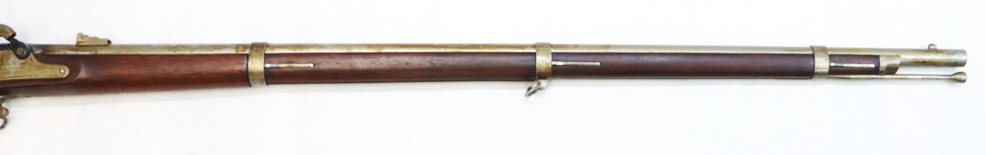 A long antique rifle with a wooden stock, metal barrel bands, and a bayonet lug, displayed on a white background.