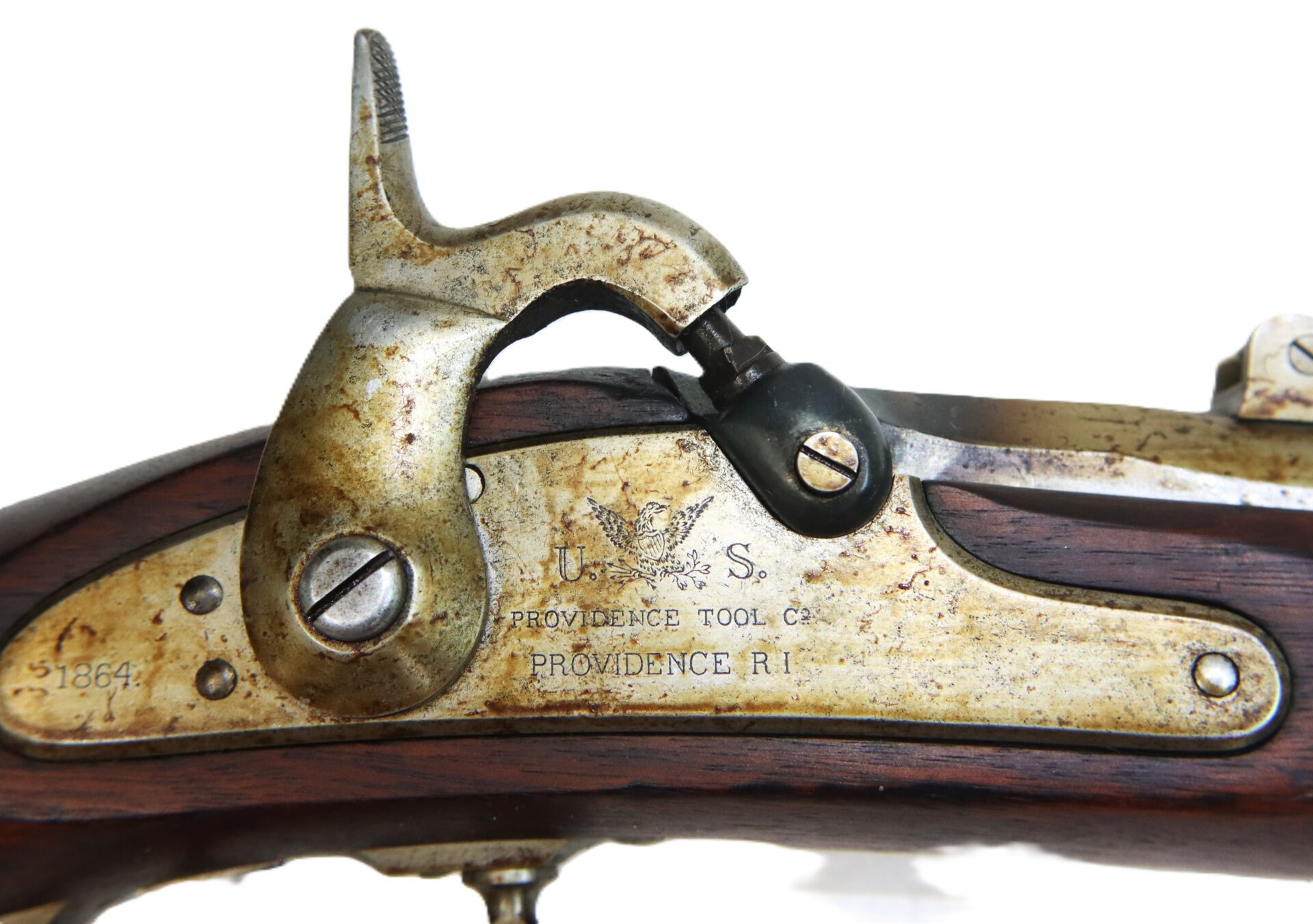 Close-up of an antique U.S. military musket lock plate marked "PROVIDENCE TOOL CO. PROVIDENCE R.I." with visible mechanisms and wood grain.