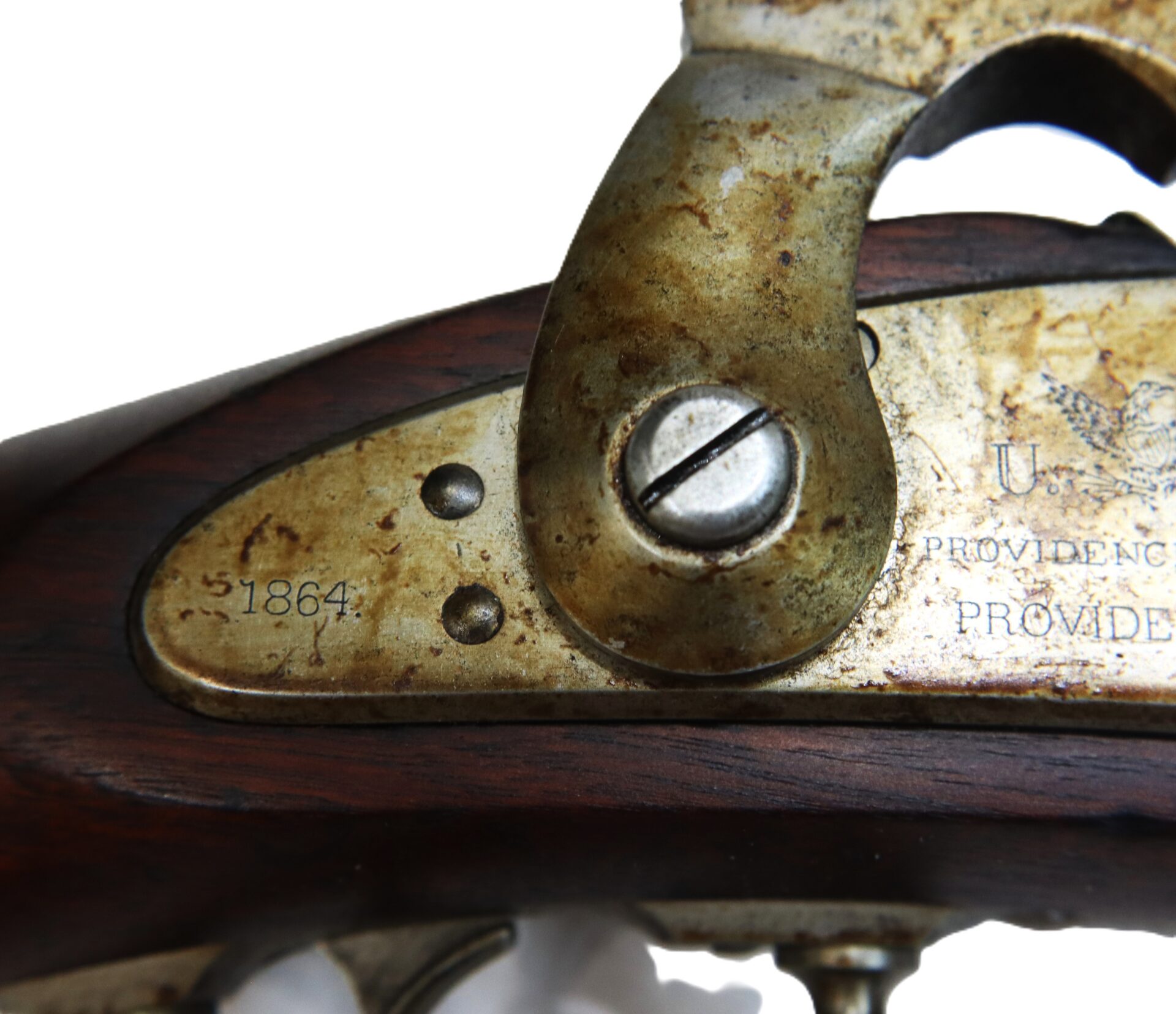 Close-up of a metal plate on an antique firearm showing serial number 51864, a screw, and partial engraved text; the metal shows signs of tarnish and wear.