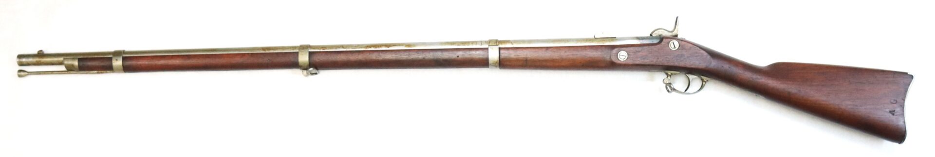 Antique bolt-action rifle with wooden stock and metal barrel, shown in a side view against a white background.