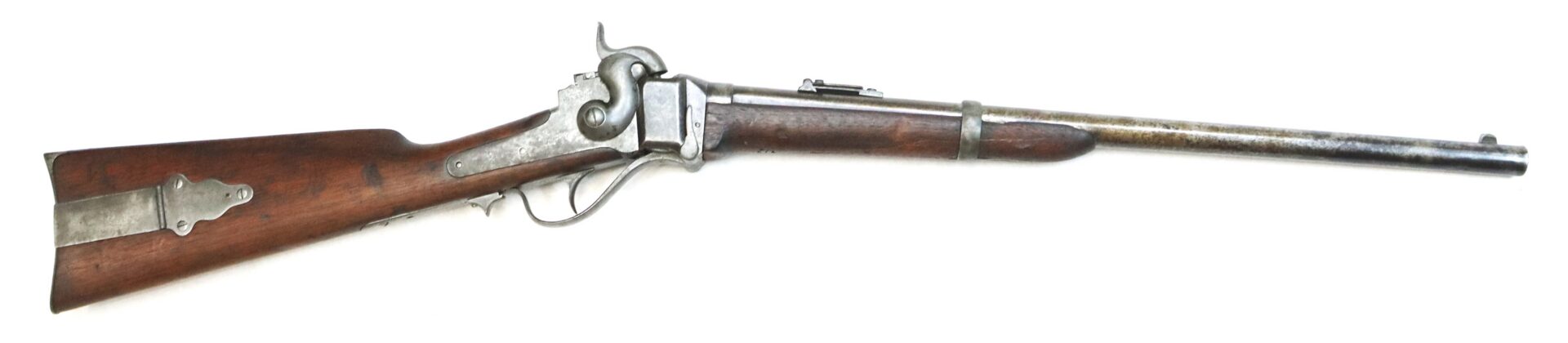 Side view of an antique lever-action rifle with a wooden stock and metal barrel, displayed against a white background.