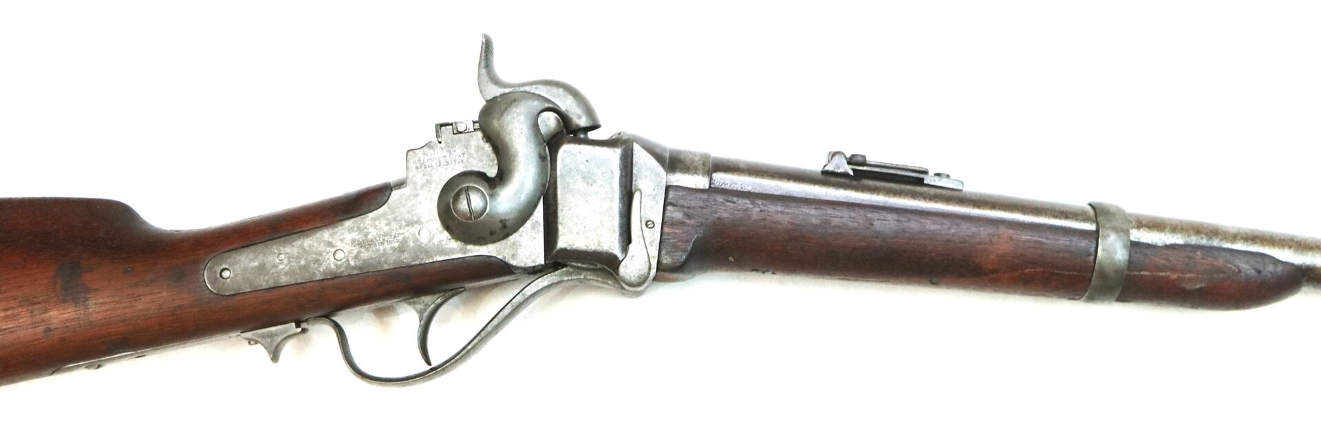 Side view of an antique single-shot lever-action rifle with a wooden stock and metal barrel against a white background.