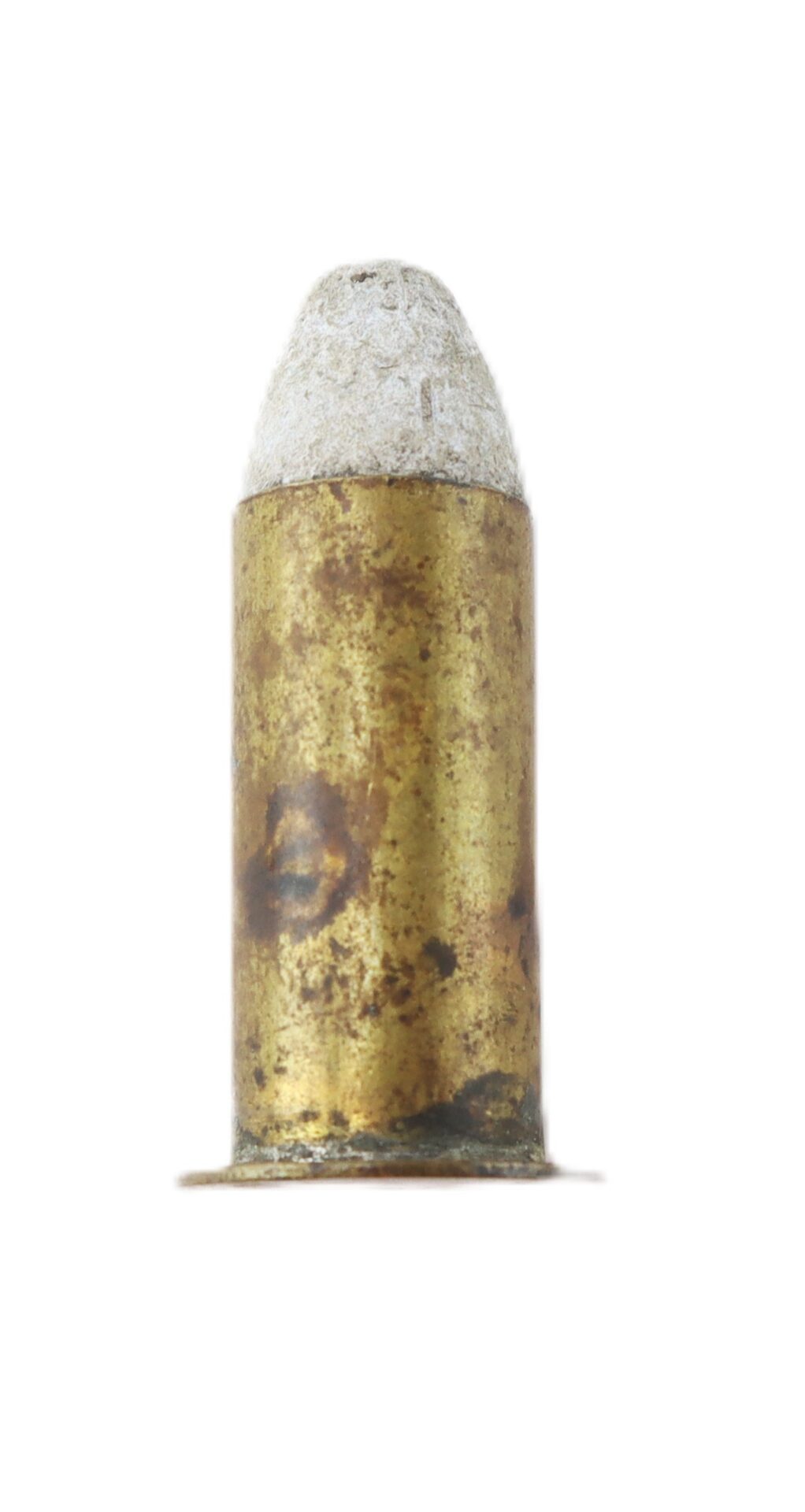 A close-up of a single, old brass bullet cartridge with a white-tipped projectile, isolated on a white background.