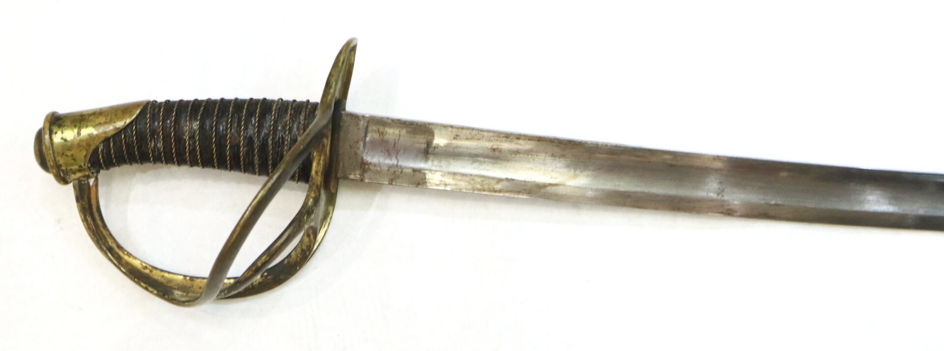 Antique sword with a brass hilt, wire-wrapped grip, and curved single-edged blade, set against a white background.