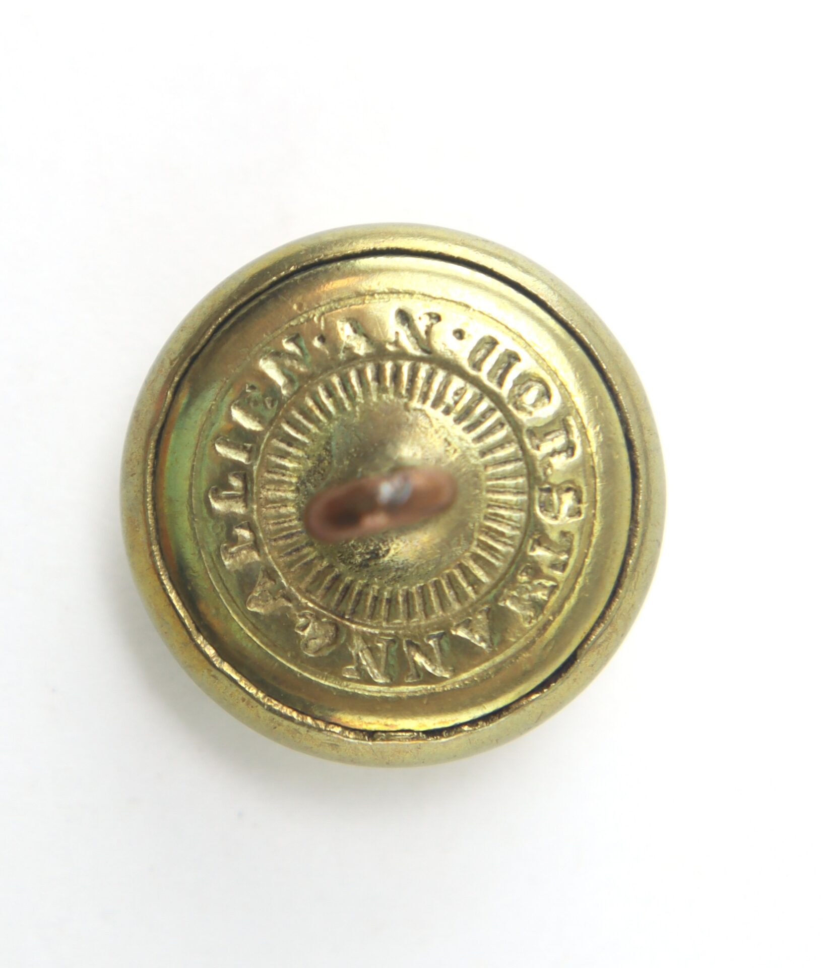 Round brass button with a raised center, a central shank, and the embossed text "WARRANTED SUPERFINE" around the edge.