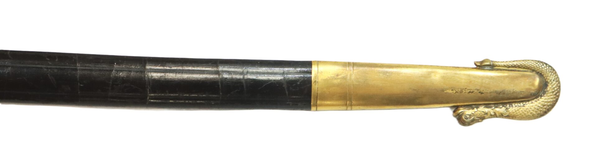 A black scabbard with a gold tip featuring a decorative snake or dragon head design.