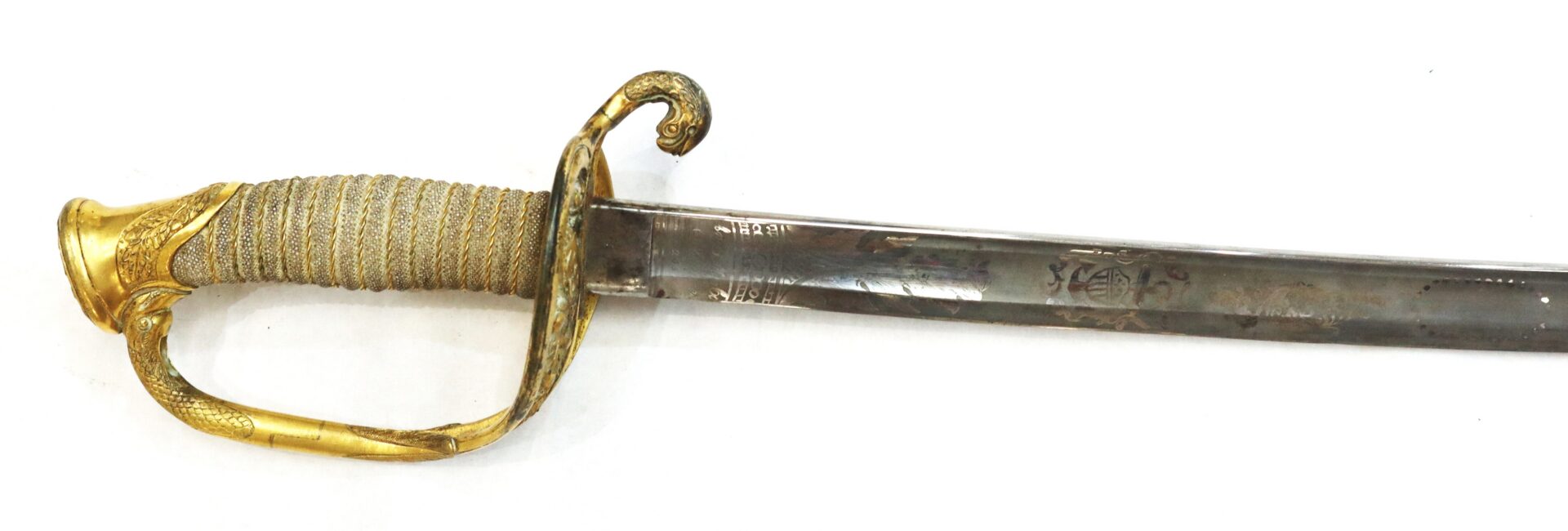 Antique sword with a gold ornate hilt and curved guard, featuring decorative patterns on both the handle and the blade.