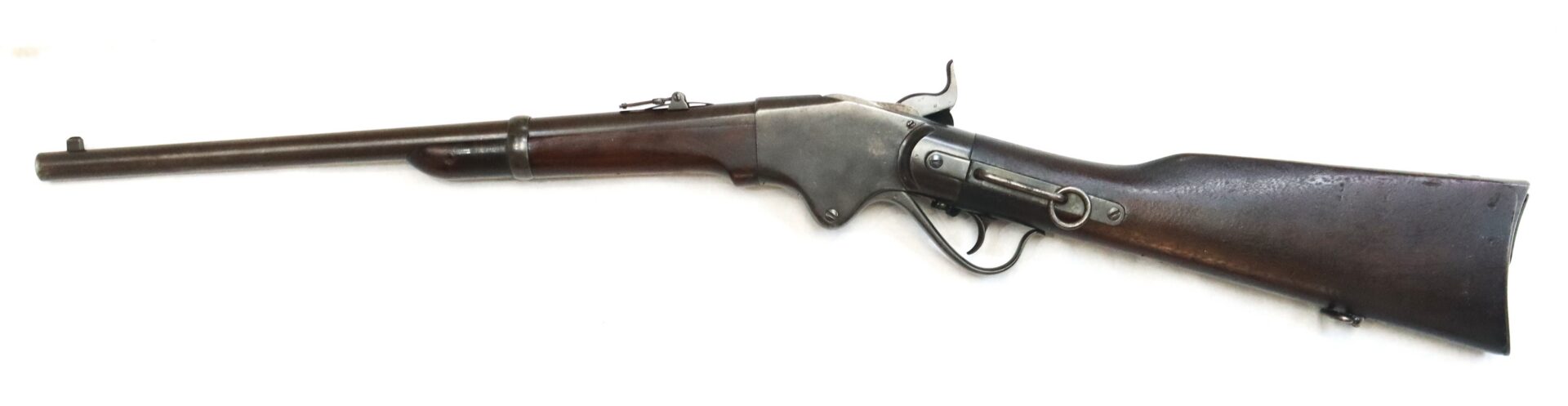 A vintage lever-action rifle with a wooden stock and metal barrel, displayed on a white background.