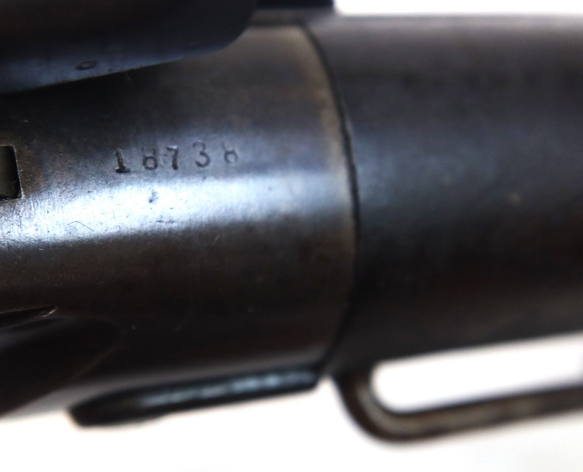 Close-up of a metal surface with the engraved number "16738" visible.