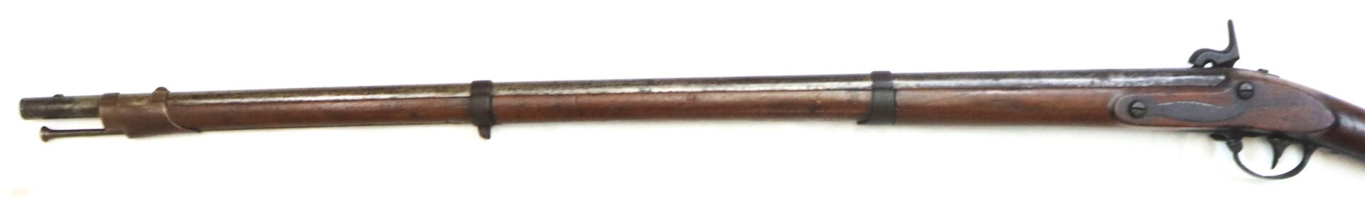 A vintage, long-barreled, muzzle-loading rifle with a wooden stock and metal fittings, shown in a side profile against a white background.
