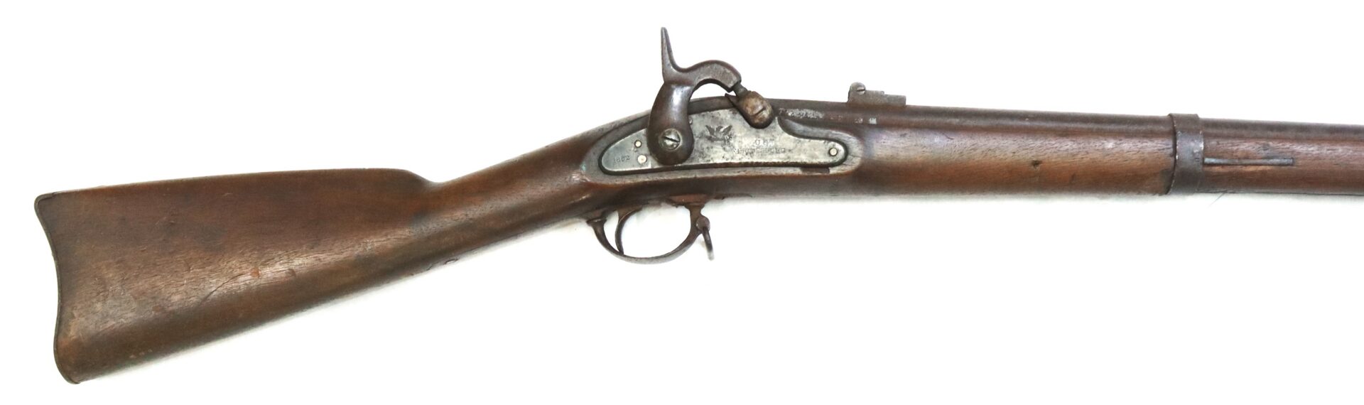Side view of an antique wooden-stocked musket with a metal trigger, hammer, and barrel, showing signs of age and wear.