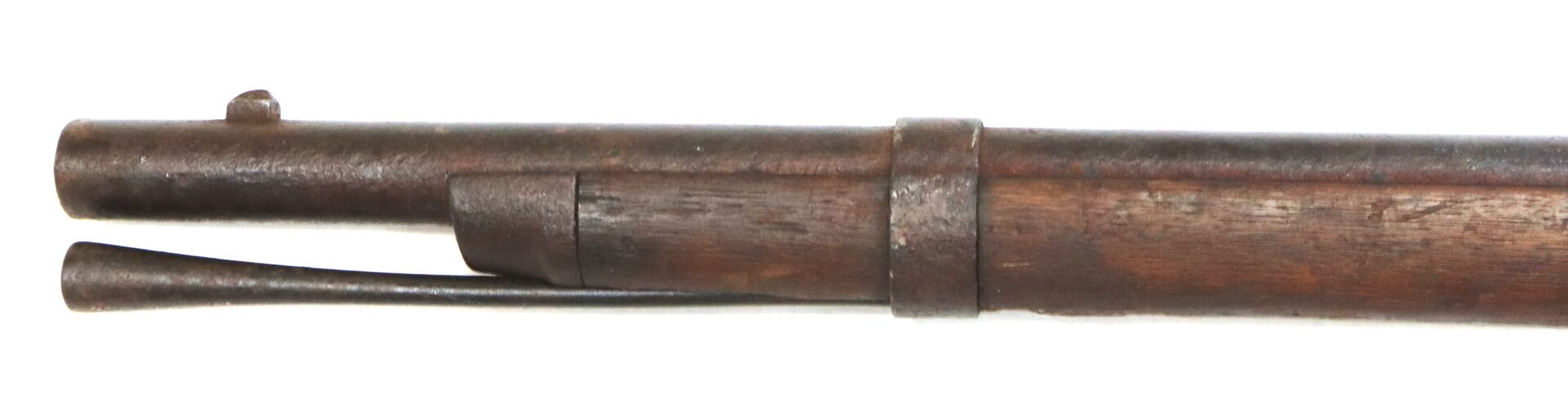 Close-up view of the barrel and stock of an old, weathered musket with an attached metal ramrod.