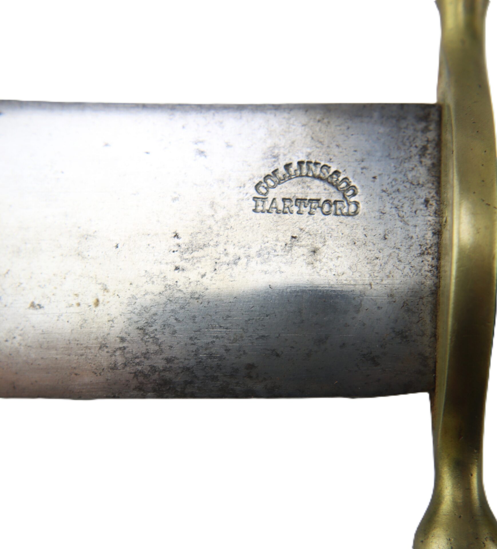 Close-up of a metal blade with the inscription "COLLINS & CO HARTFORD" near a brass guard.