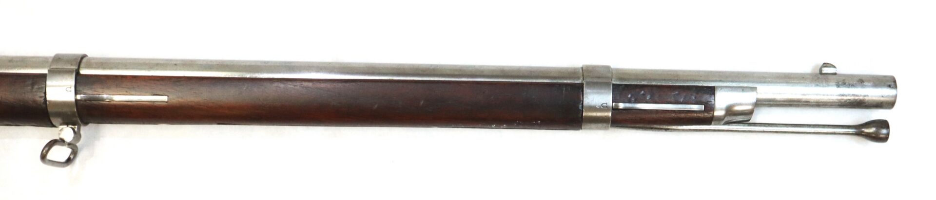 Close-up view of the front section of a vintage bolt-action rifle showing the wooden stock, metal barrel, and bayonet lug.
