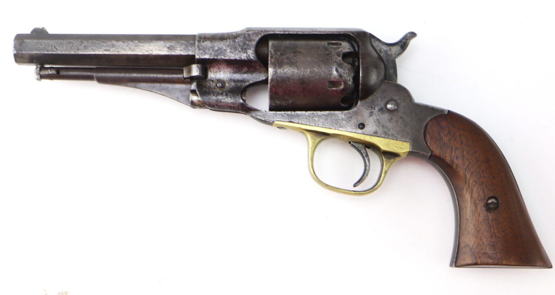 Antique revolver with a dark metal barrel and cylinder, brass trigger guard, and wooden grip, displayed on a white background.