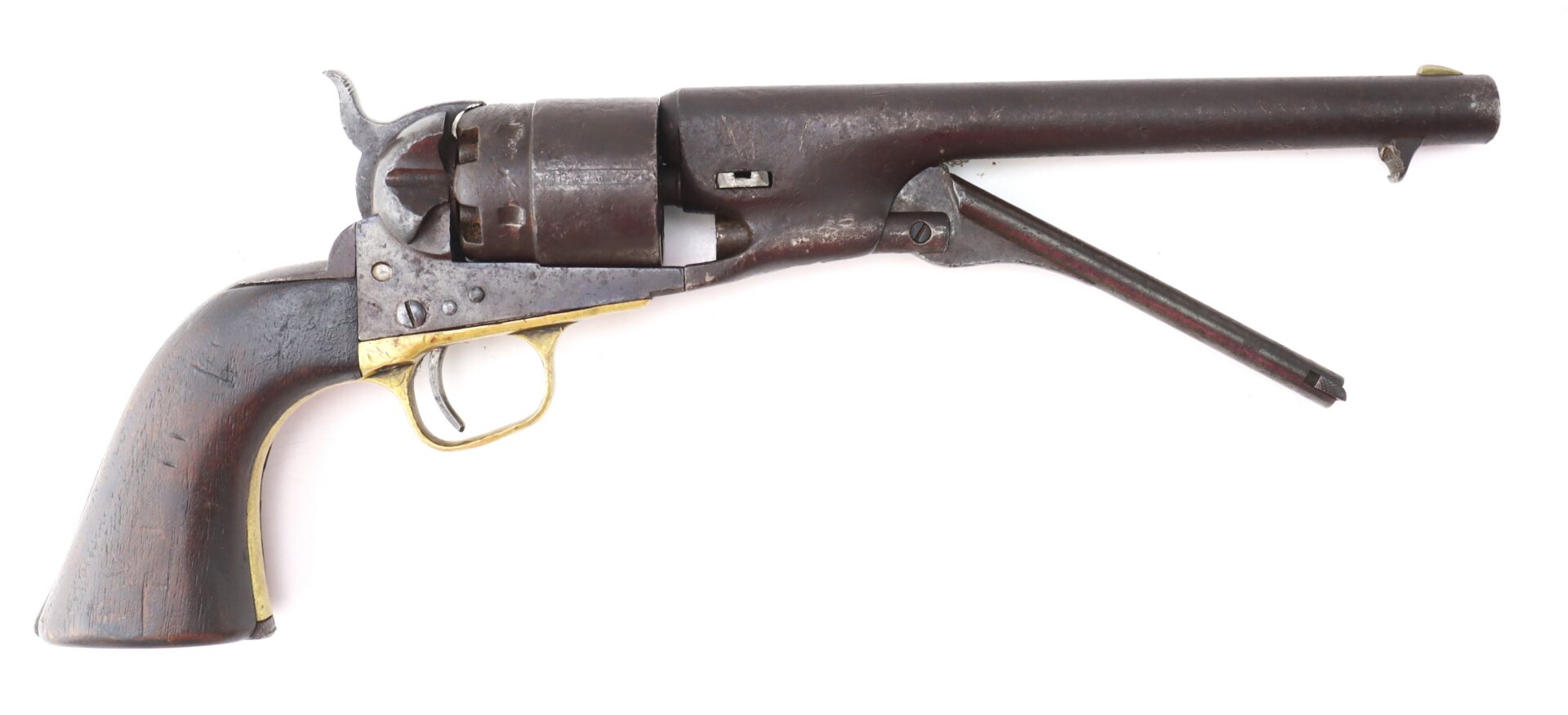 A vintage black powder revolver with a wooden grip, metal frame, and an underbarrel loading lever, displayed on a white background.
