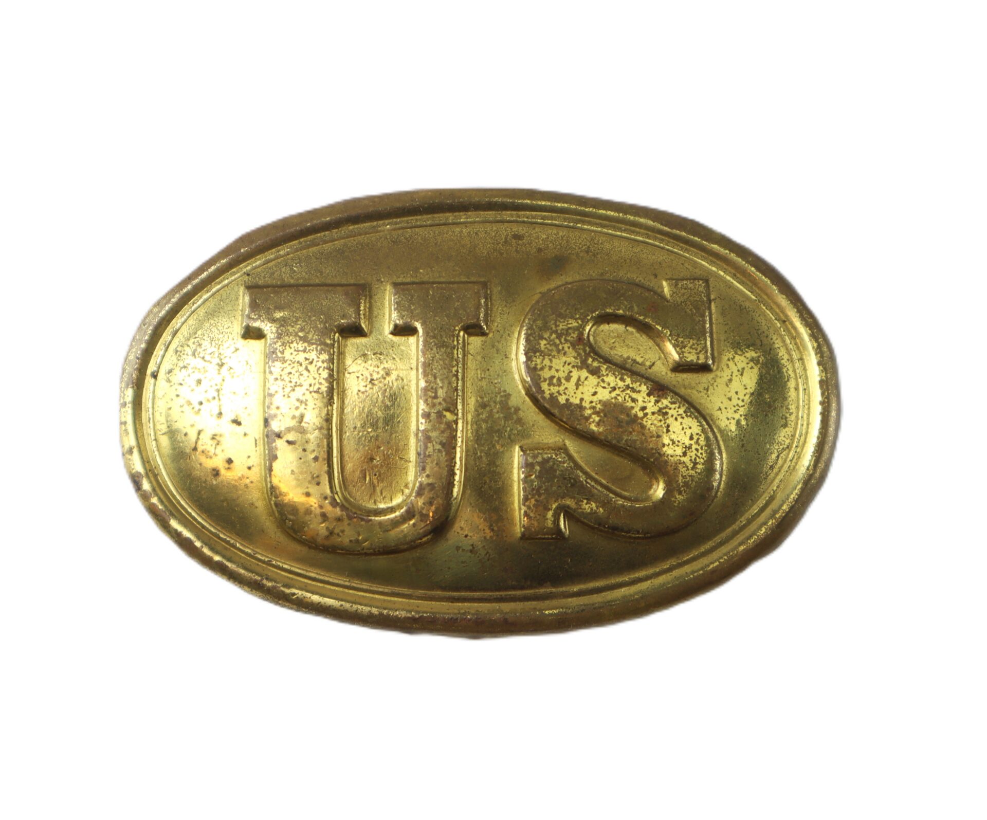 Oval-shaped brass belt buckle with raised “US” letters, showing some wear and tarnish, on a white background.