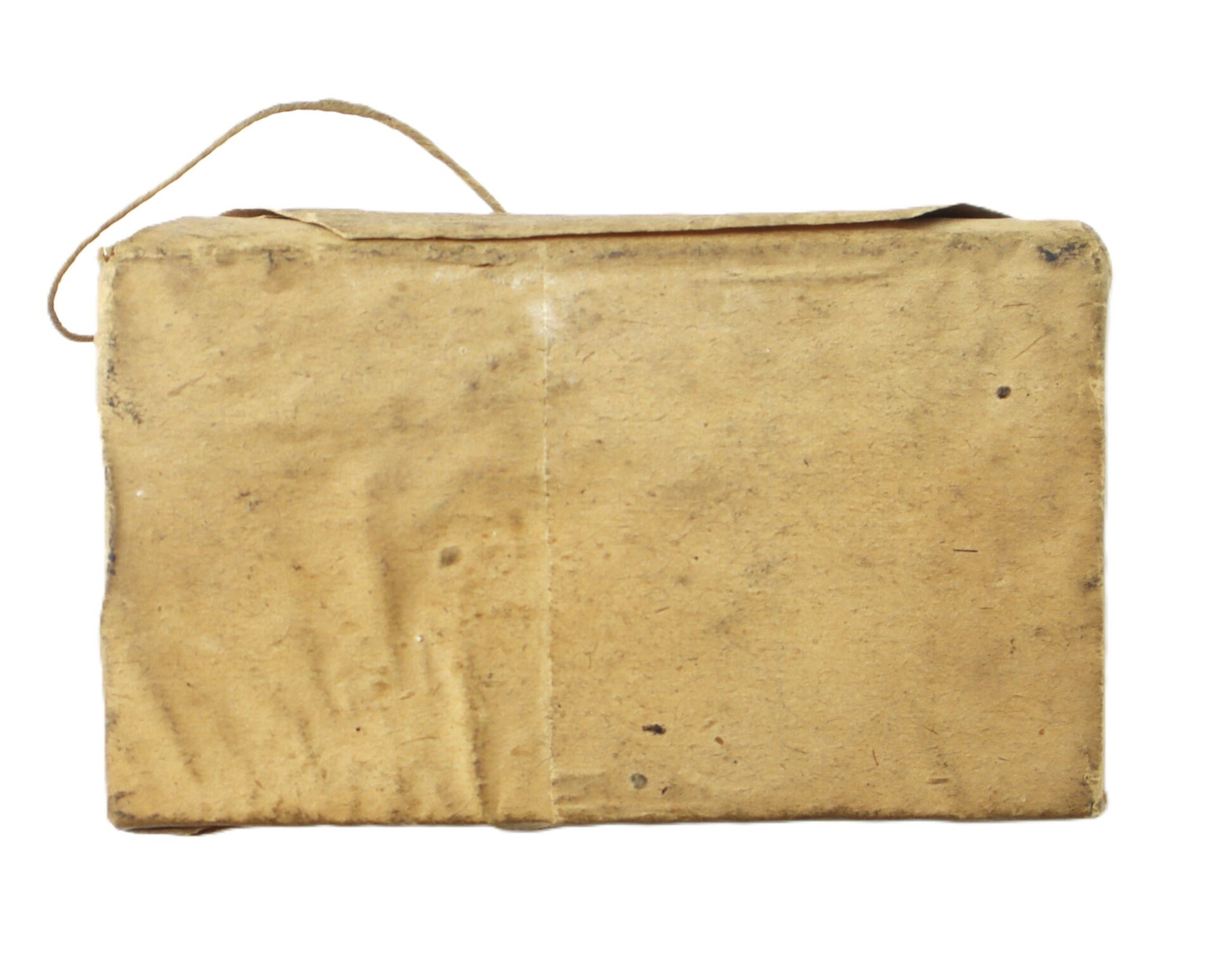 A rectangular box wrapped in brown paper with a string handle attached to one side, photographed against a white background.