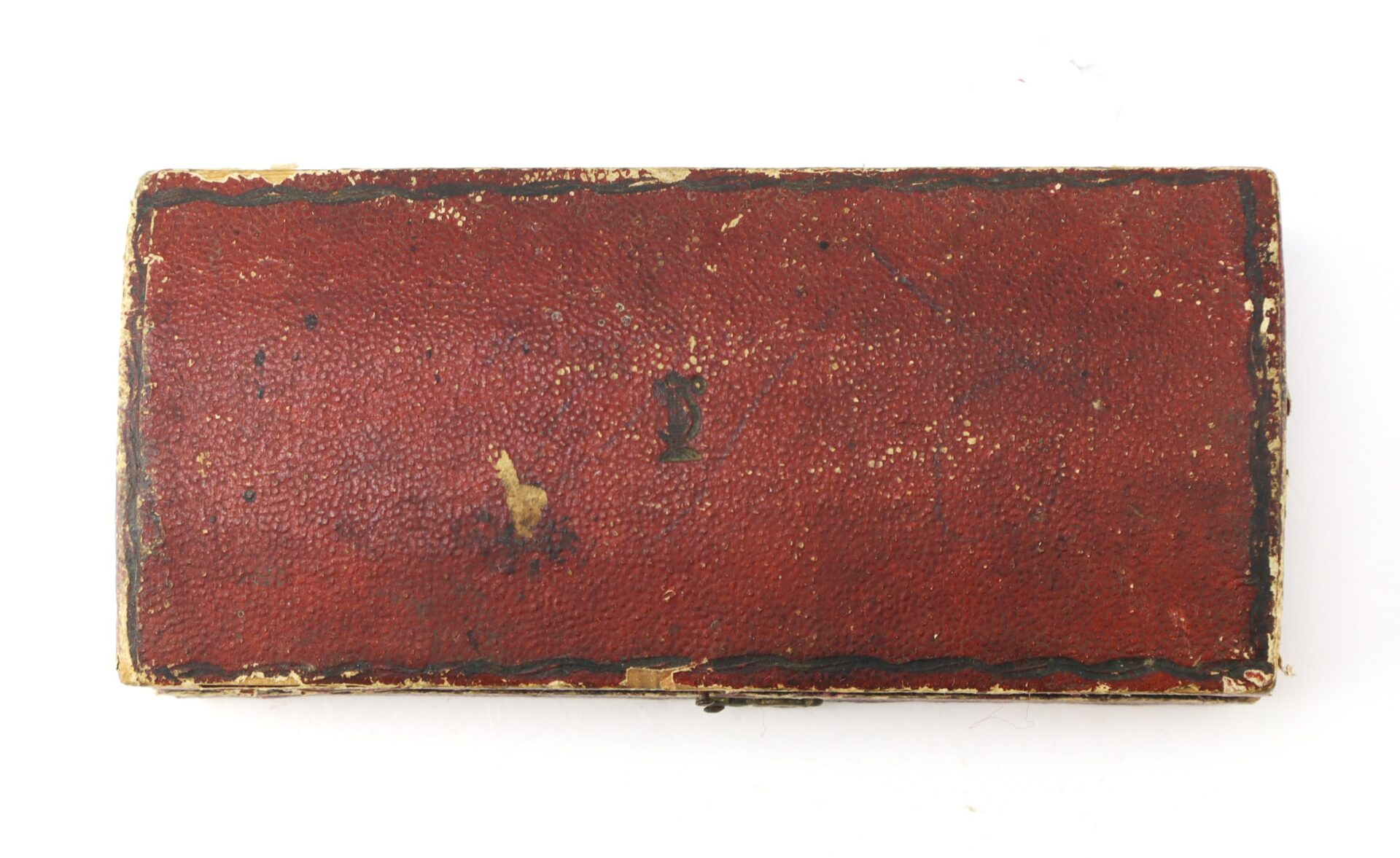 A rectangular red leather AUTO-DRAFT (Copy) case, featuring scuffed edges and minor discoloration, is photographed against a white background.