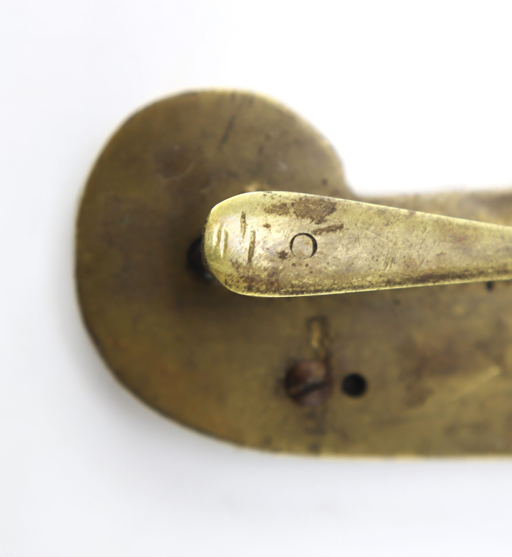 Close-up of the AUTO-DRAFT (Copy) door handle and plate, showing an aged, tarnished brass finish with visible scratches and a small circular indentation on the handle.