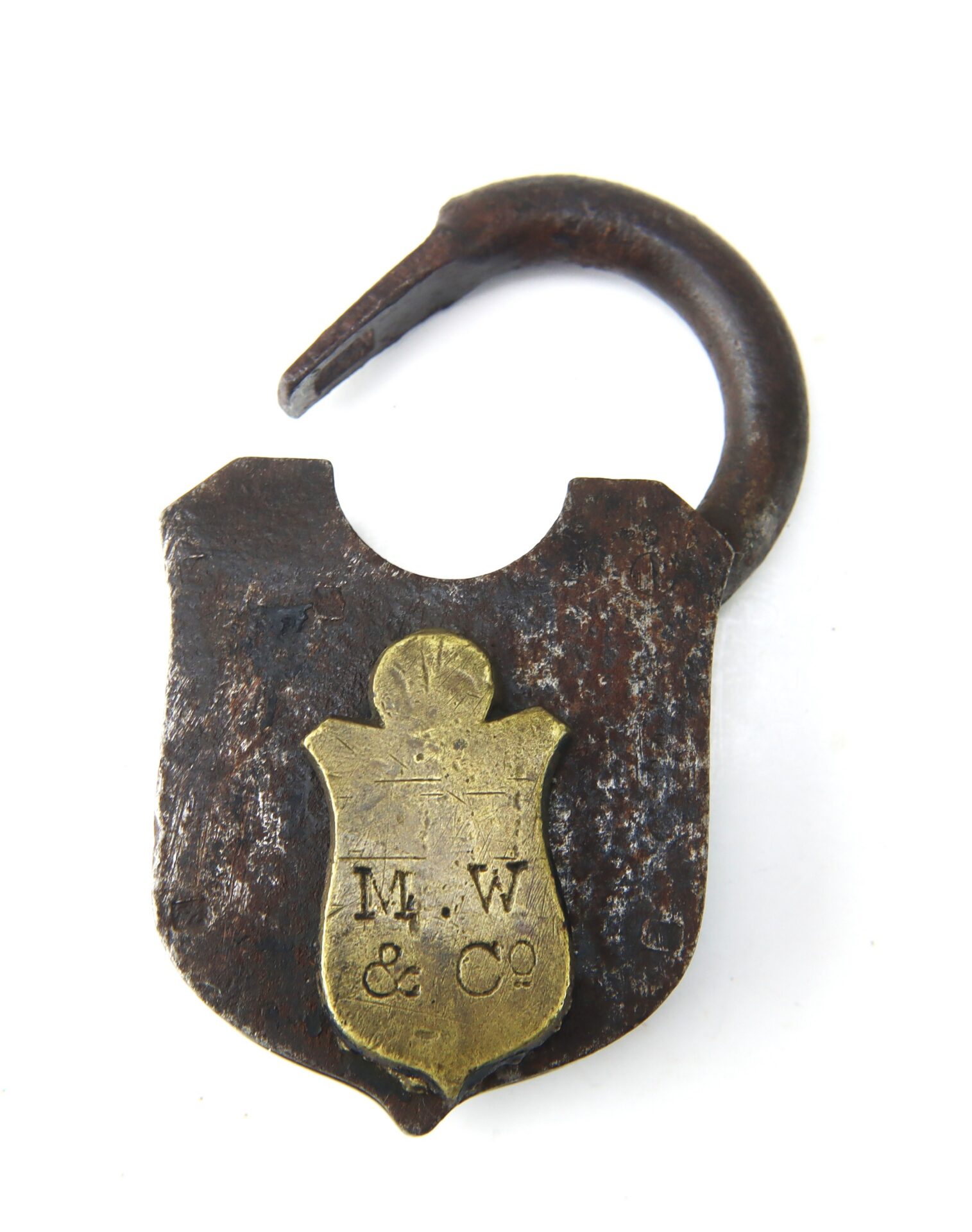 Rusty, open padlock with a brass plate engraved “M.W. & Co” on the front, photographed against a plain white background.