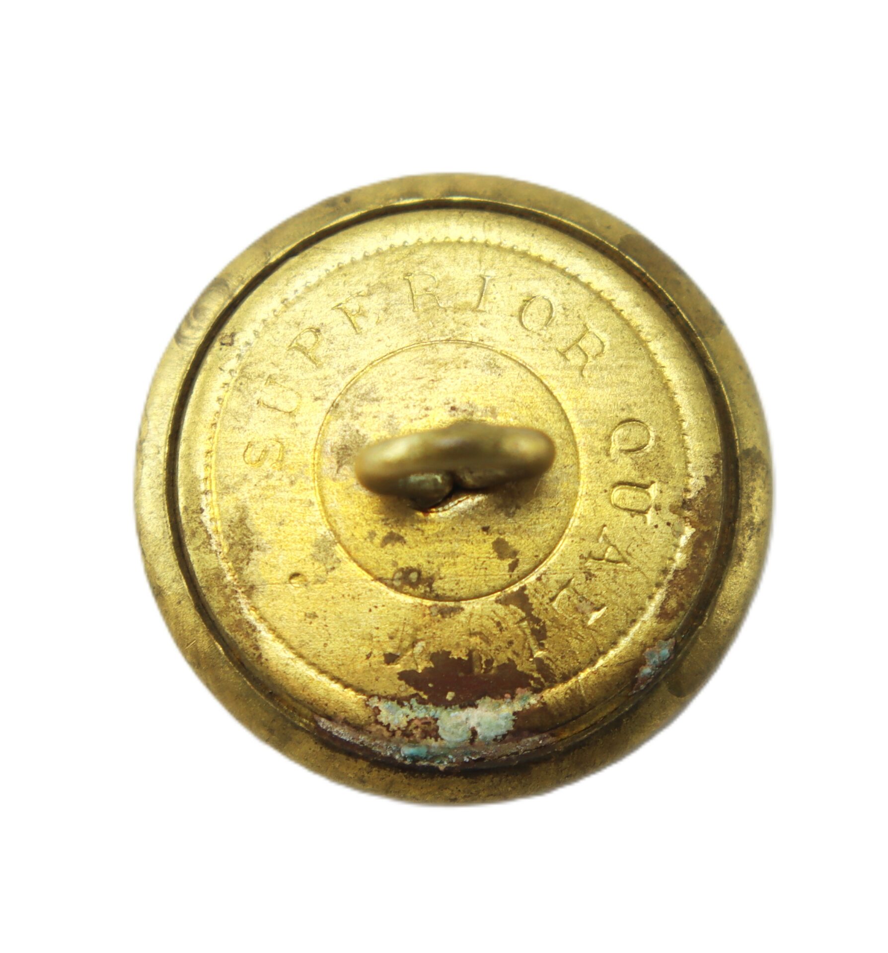 Round, tarnished brass button with a loop shank and the partially visible inscription “SUPERIOR QUALITY” on the back, photographed against a white background.