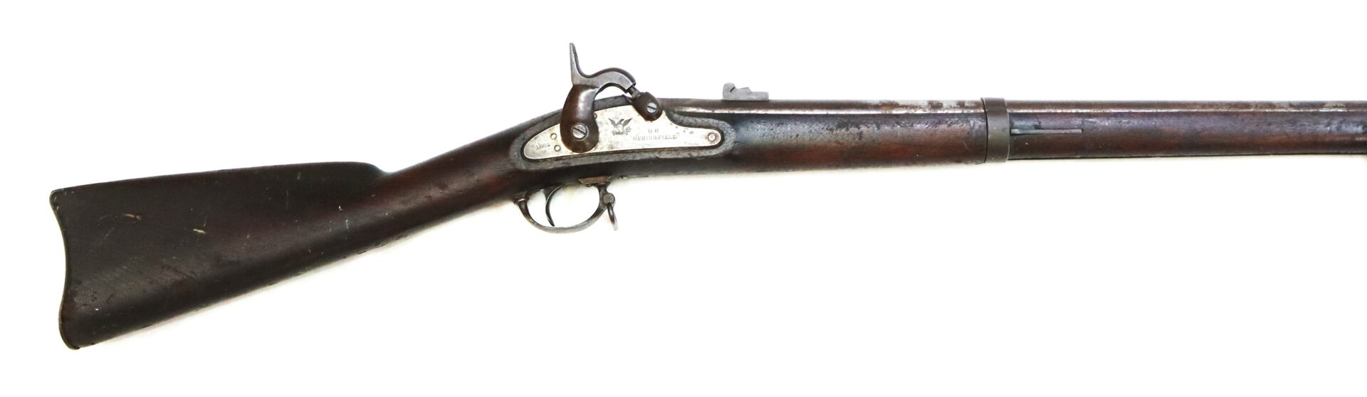 Antique musket with a wooden stock, metal barrel, and percussion lock mechanism, shown in a side profile against a white background.
