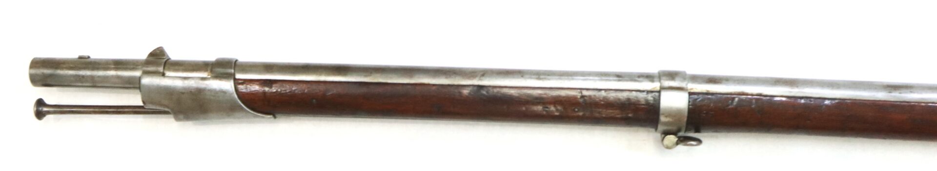 Partial view of an antique rifle barrel with a wooden stock, metal bands, and a protruding cleaning rod against a white background.