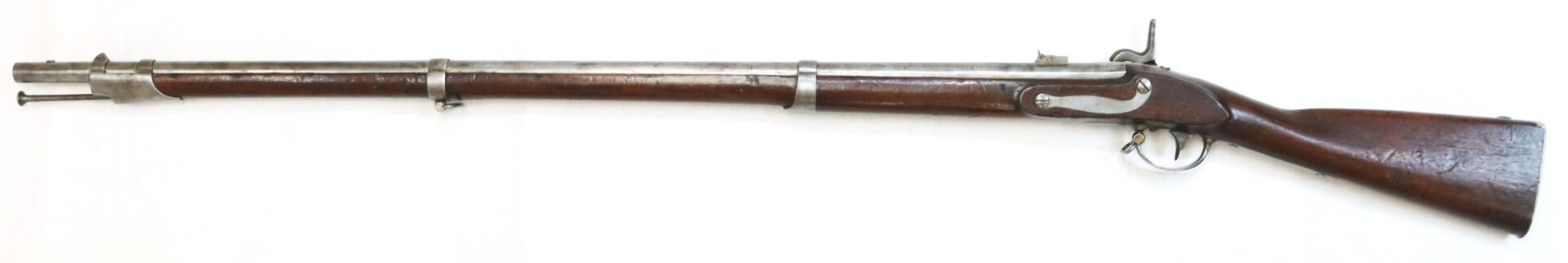 A vintage, long-barreled musket with a wooden stock, metal barrel, and trigger mechanism, displayed on a white background.