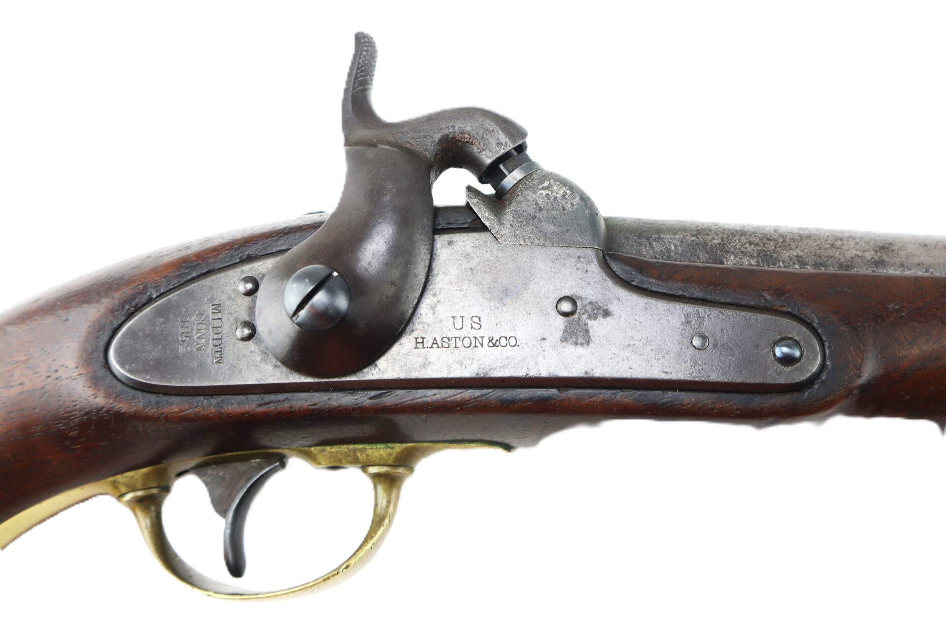 Close-up of an antique percussion lock mechanism on a rifle, showing “U.S. HASTON & CO.” engraved on the metal plate.