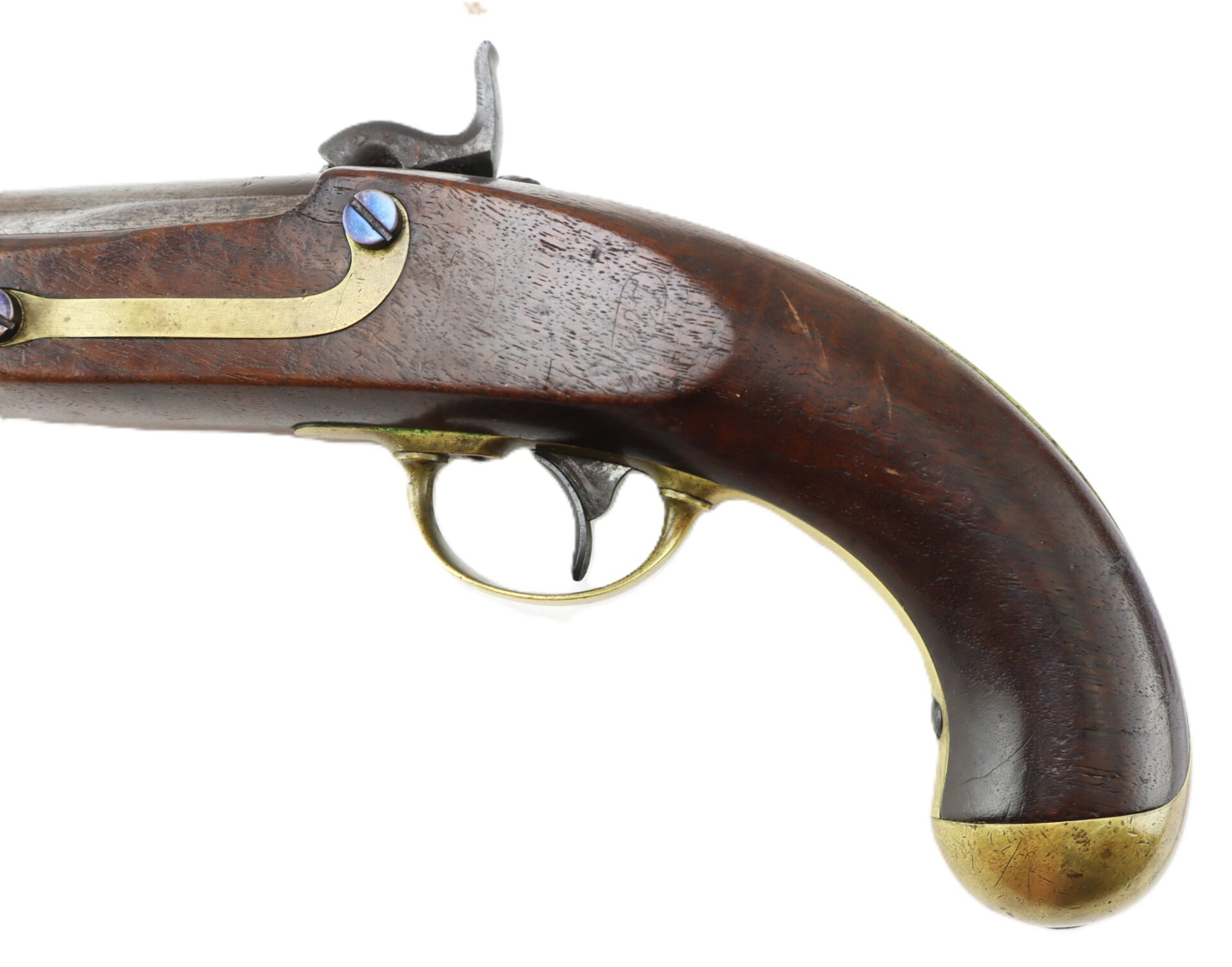 Close-up of an antique flintlock pistol with a wooden handle, brass trigger guard, and metal accents, viewed from the side.