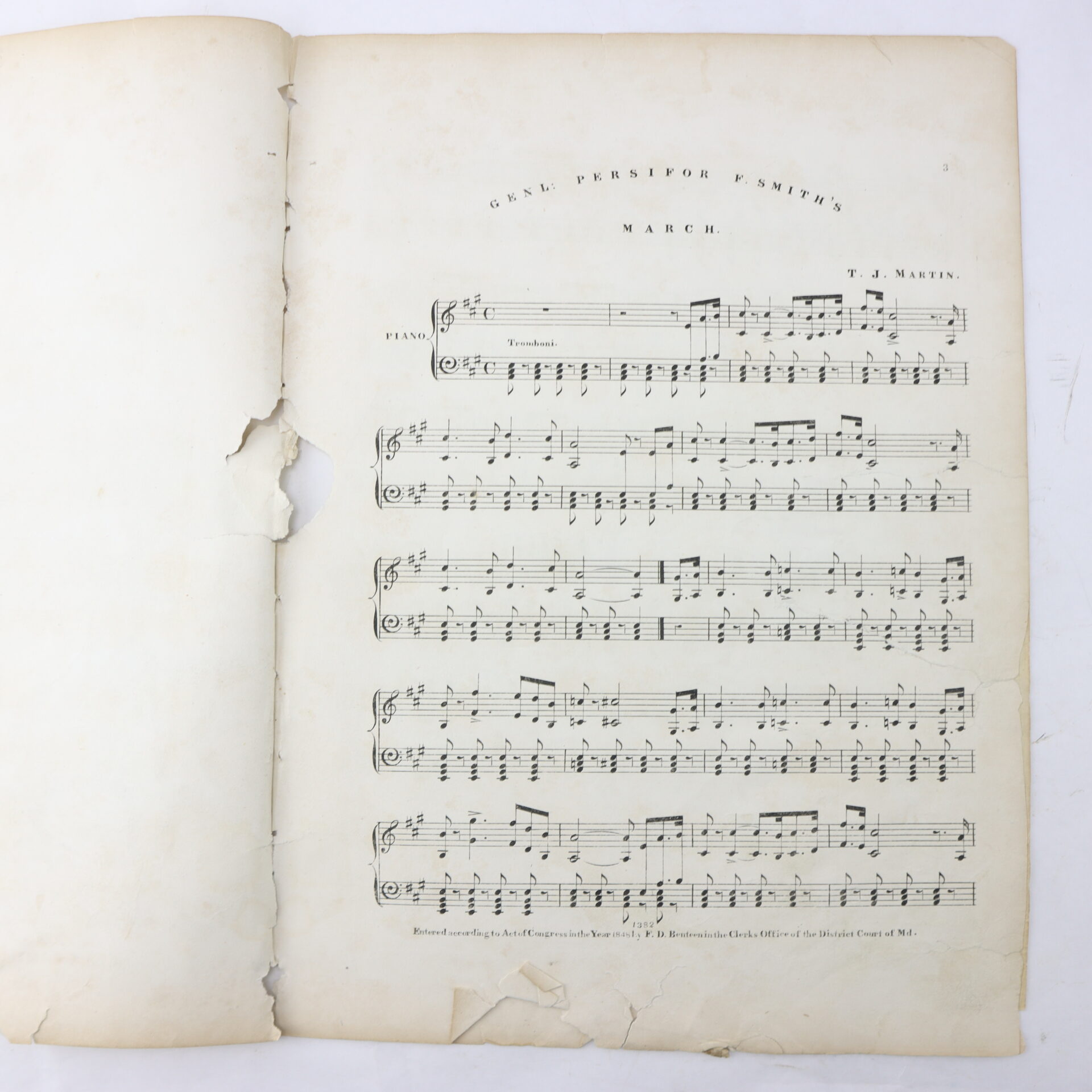 A torn, aged sheet of music titled “Genl Persifor Smith’s March” by T.J. Martin, printed for piano, with visible water damage and frayed edges.