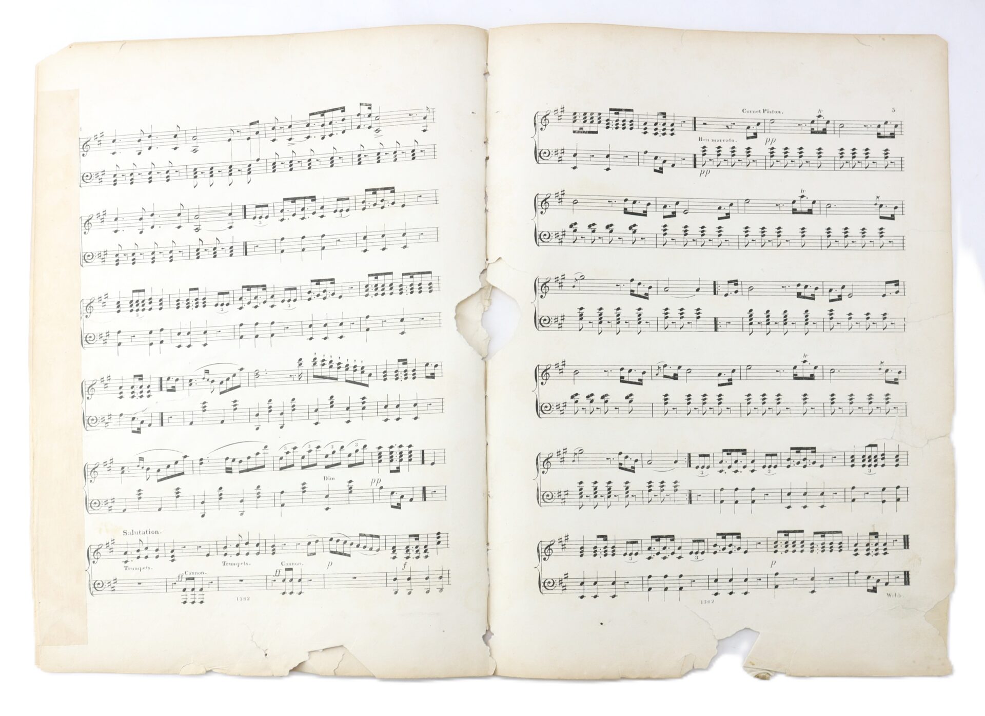 Two pages of aged, torn sheet music with printed musical notation and text, showing visible damage along the center and bottom edges.