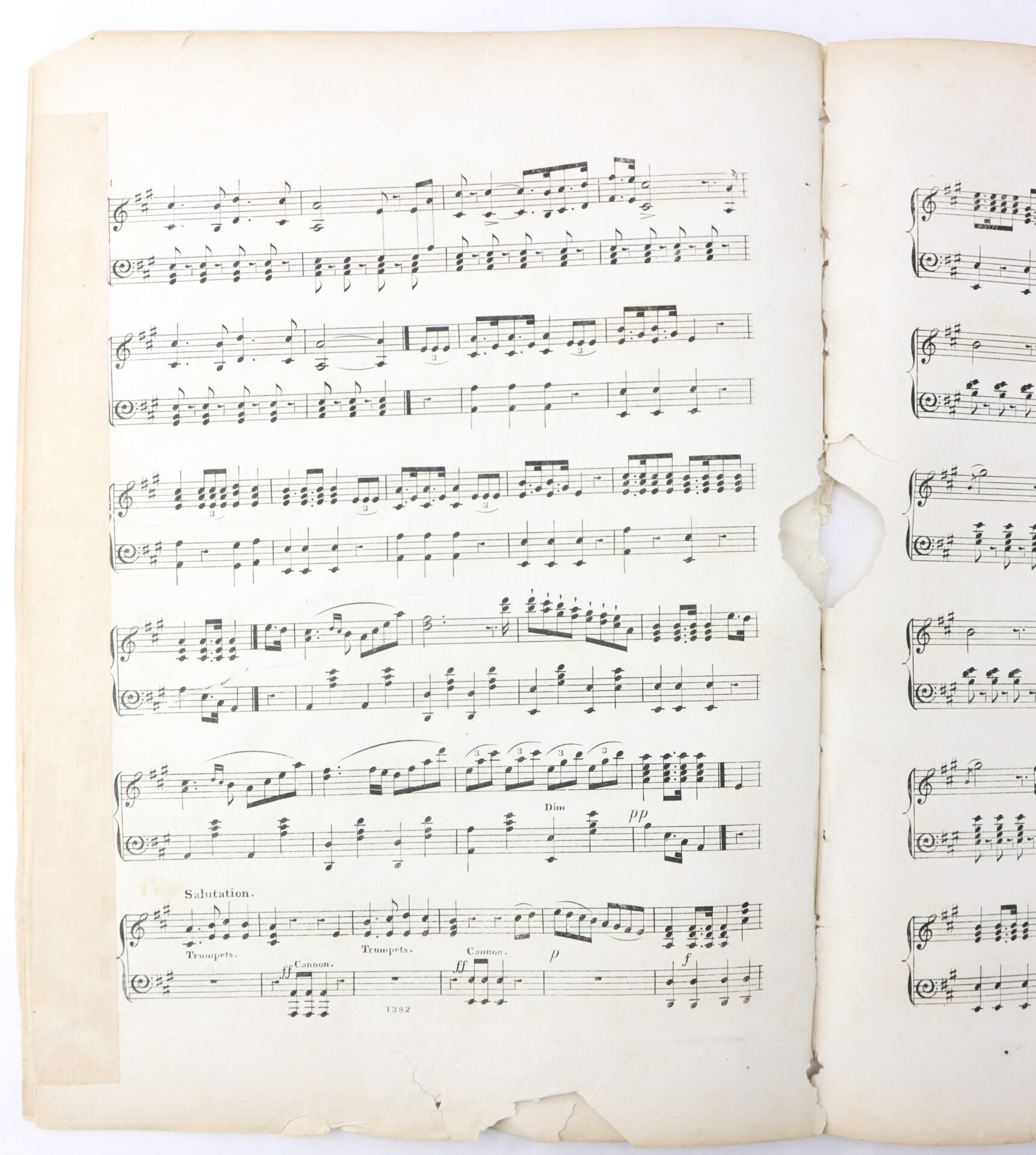 A worn sheet music page with black musical notes and symbols on aged, slightly torn paper. A large hole and tears are visible on the right side and bottom edges of the page.