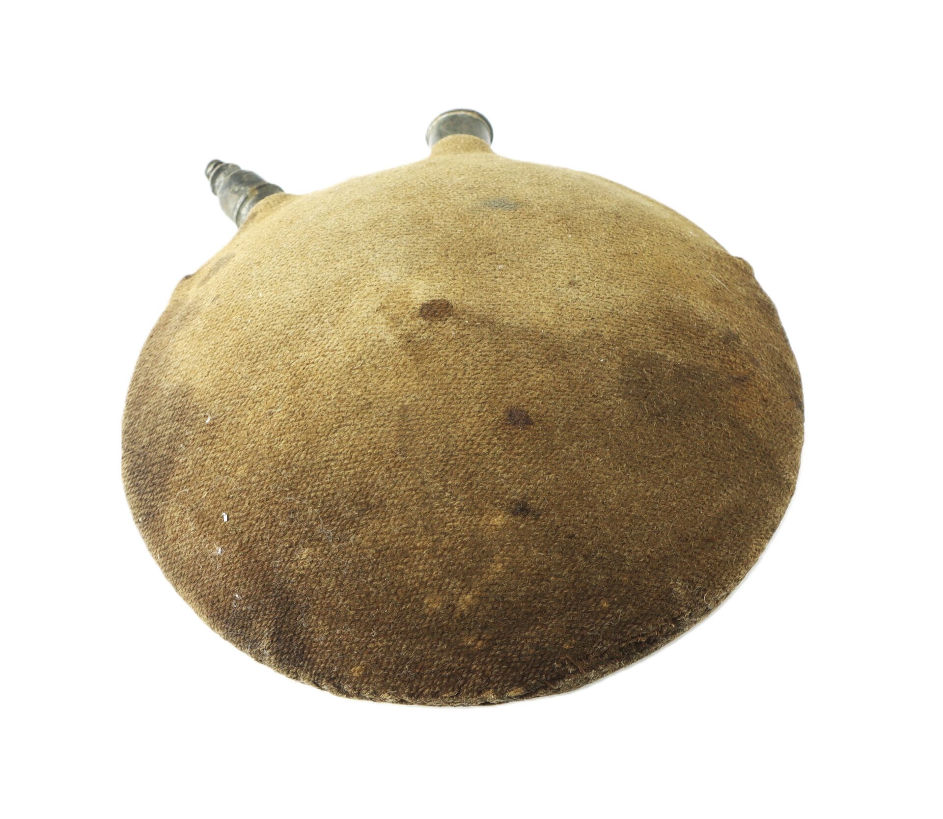 A round, flat, fabric-covered canteen with two metal spouts, showing signs of wear and discoloration.
