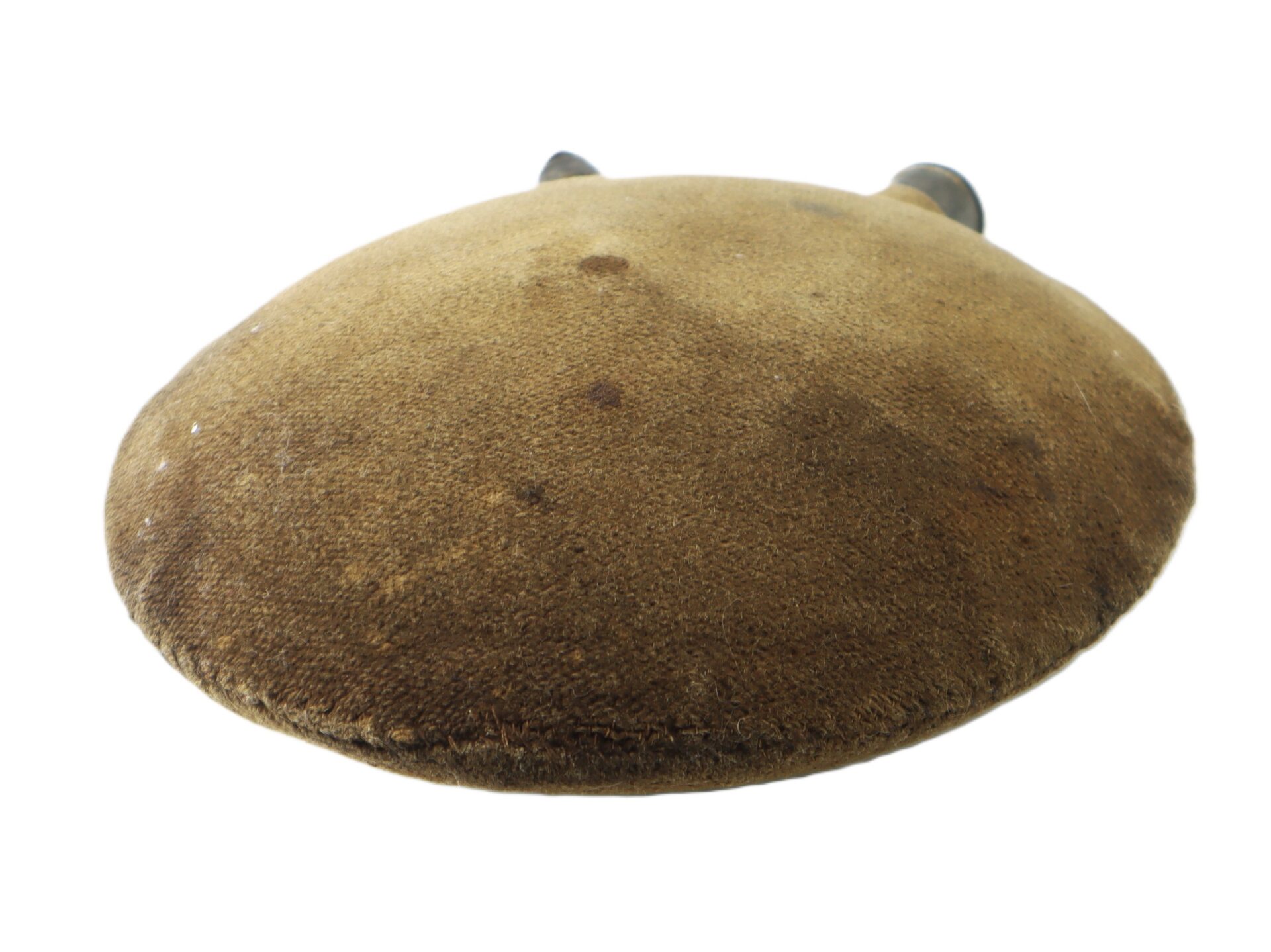 A round, brown, fabric-covered canteen with a worn surface and two small spouts at the top.