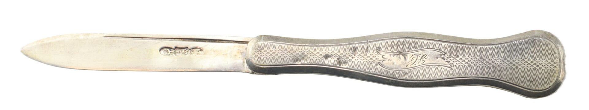 A vintage metal pocketknife with a textured handle and a closed-back blade laying flat on a white background.