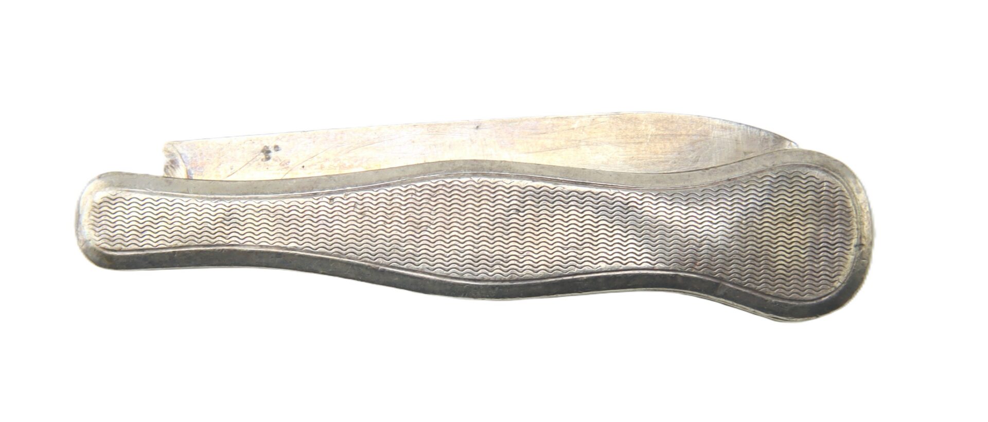 A closed folding pocket knife with a textured metal handle and a partially visible blade, photographed on a white background.