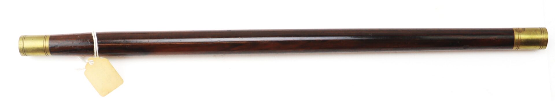A wooden cylindrical tube with brass fittings on both ends and a paper tag attached near one end, against a white background.