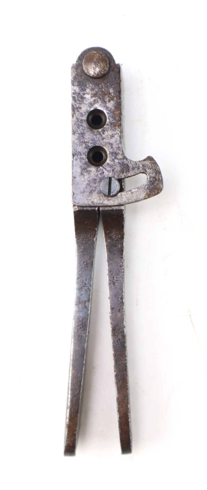 A vintage metal bullet mold tool with two circular cavities and a pivoting sprue cutter.