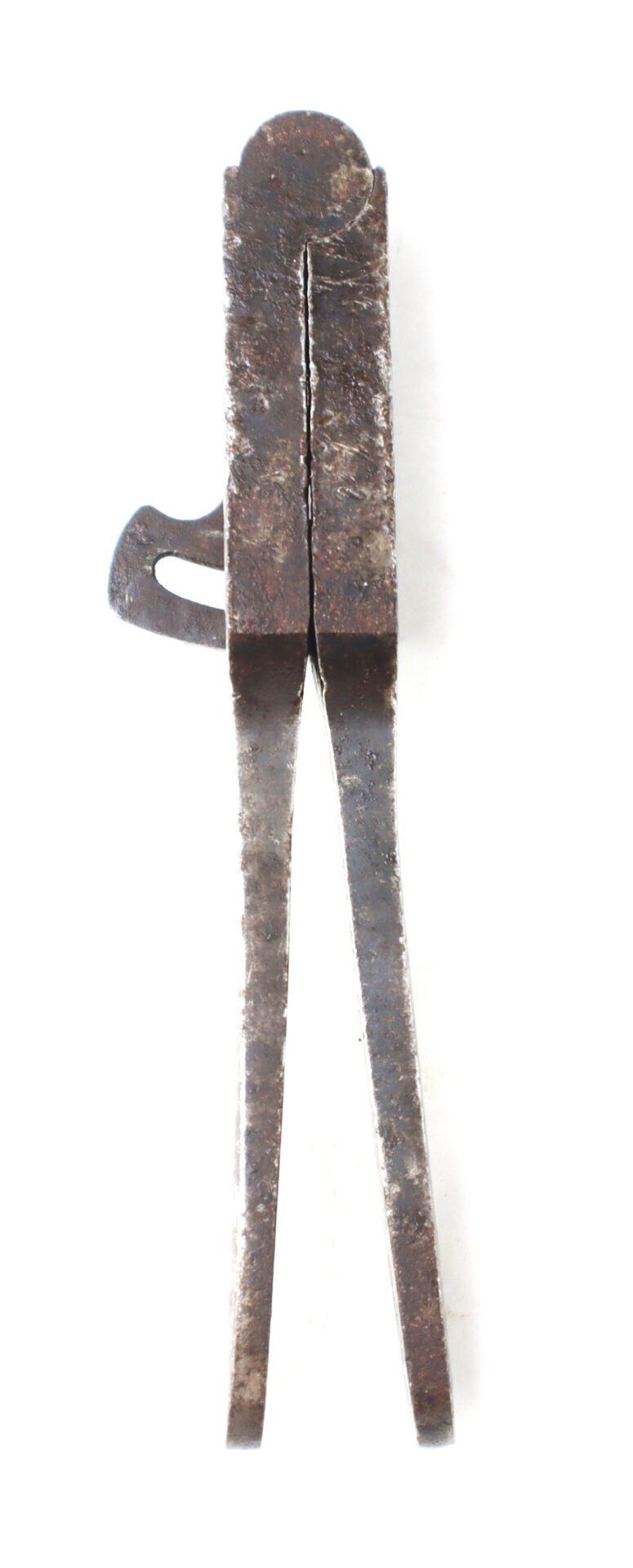 Antique metal tongs or mold with a long handle and a small side hook.