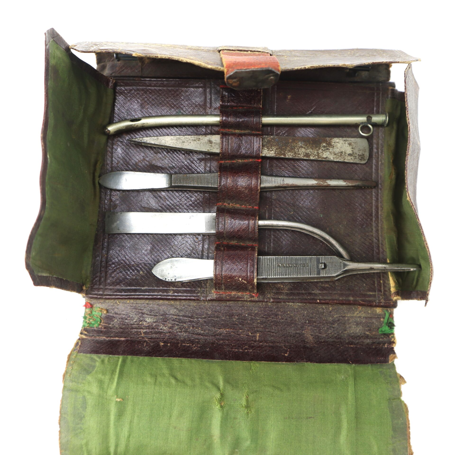 A vintage leather medical kit containing five metal surgical tools.