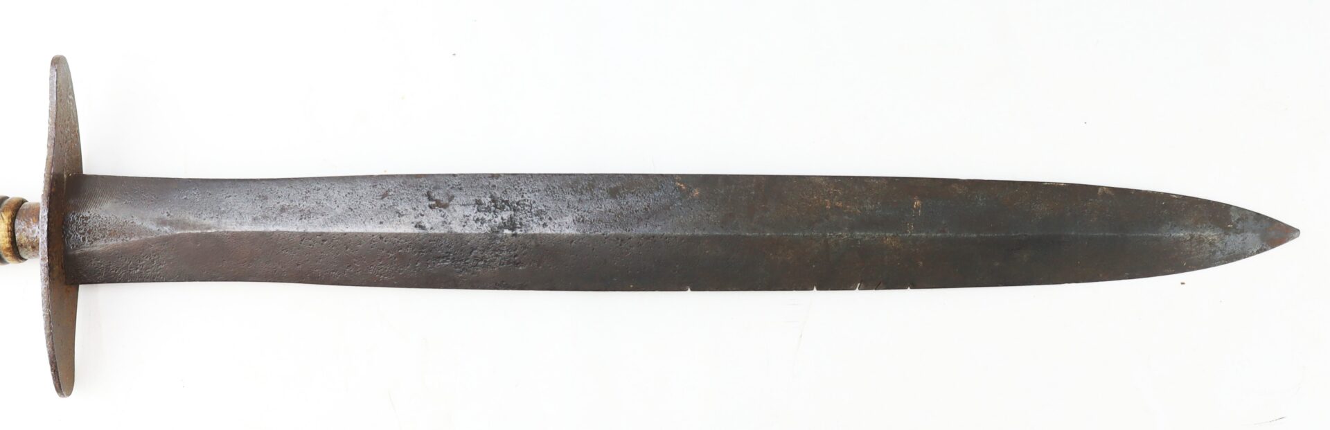 A double-edged antique dagger with a metal crossguard.